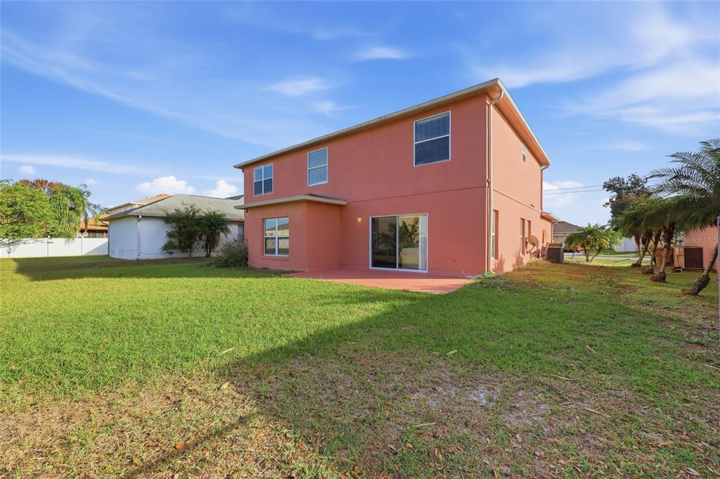 547 Brighton Court Kissimmee, FL 34758 - Photo 33 of 36 a view of a yard in front of a house with a yard