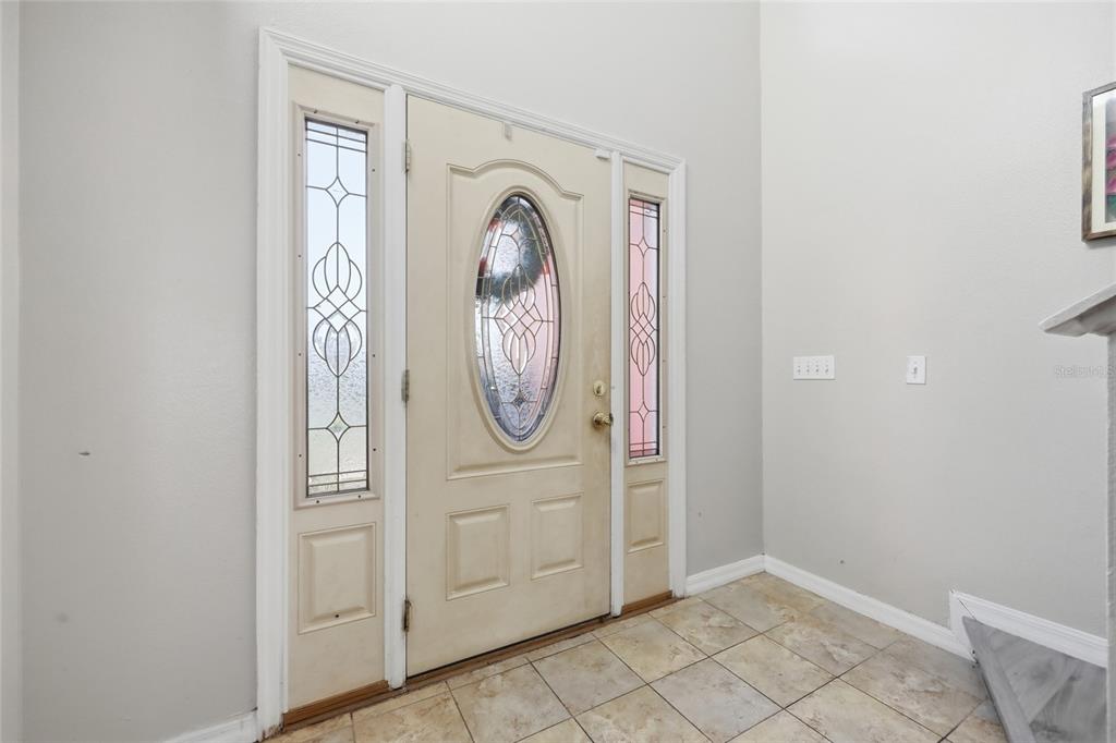 547 Brighton Court Kissimmee, FL 34758 - Photo 4 of 36 a view of a livingroom with storage and utility area
