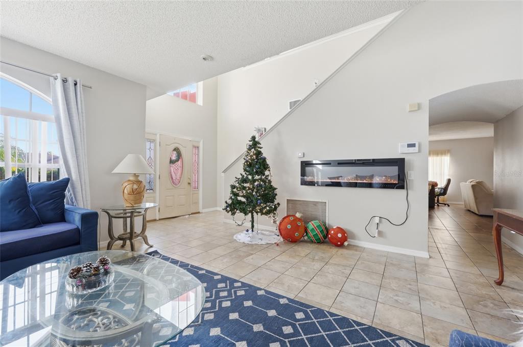 547 Brighton Court Kissimmee, FL 34758 - Photo 7 of 36 a living room with furniture and a table