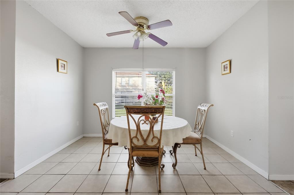 547 Brighton Court Kissimmee, FL 34758 - Photo 9 of 36 a view of a dining room with furniture window and outside view