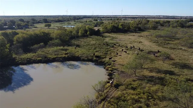 a view of lake with green space