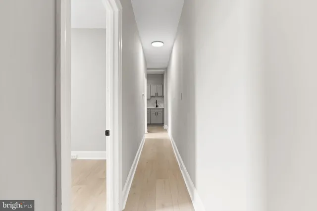 a view of a hallway with a white walls
