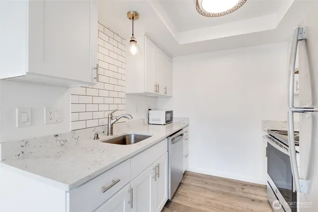 a kitchen with a sink and cabinets