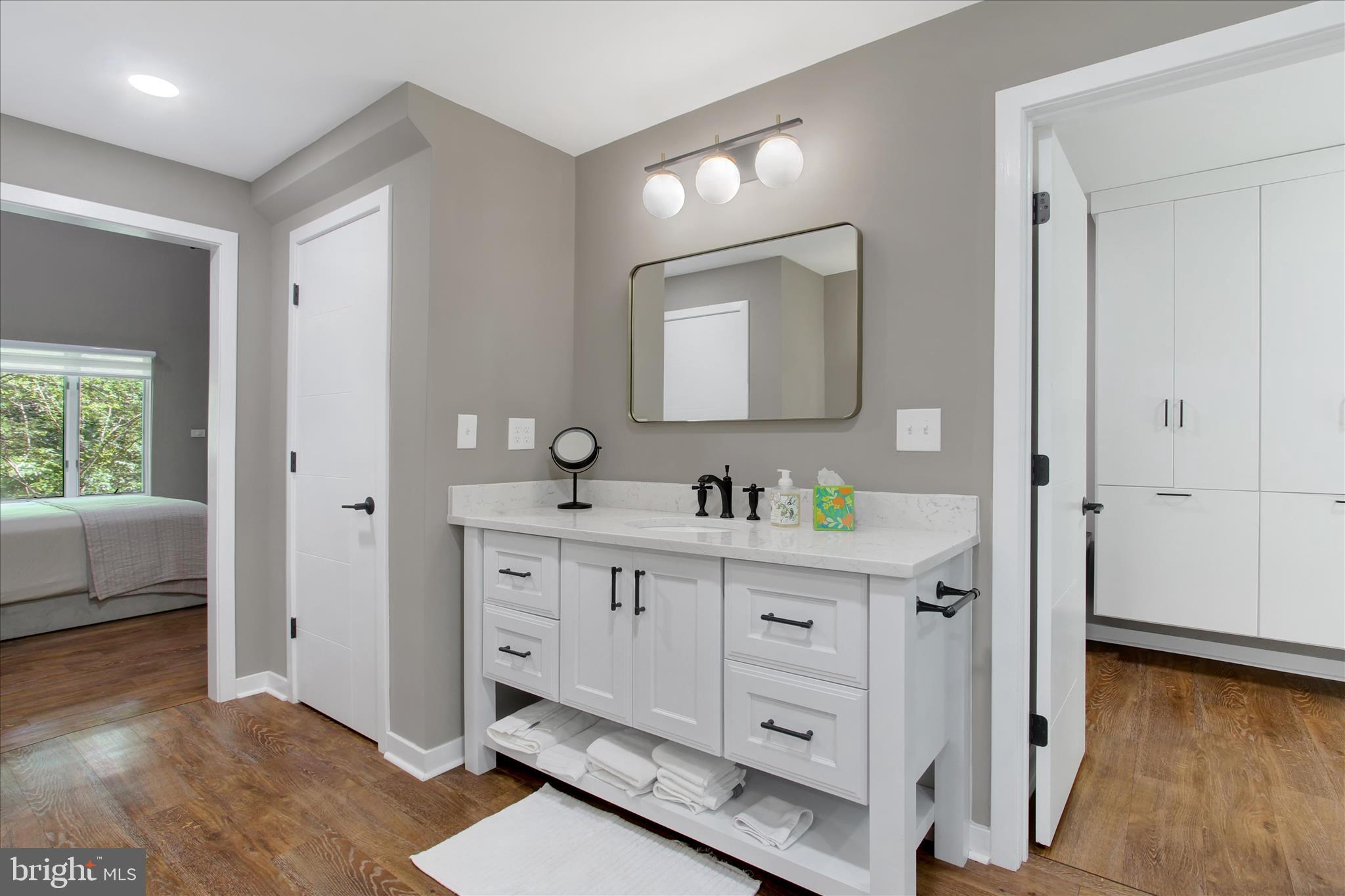 1855 Westwood Road York, PA 17403 - Photo 29 of 60 a spacious bathroom with a double vanity sink a mirror and a bathtub