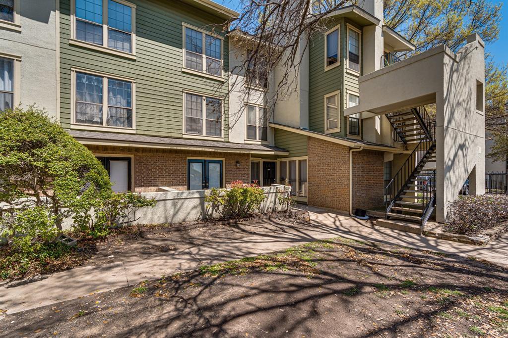 9611 Walnut Street, Unit 1106 Dallas, TX 75081 - Photo 1 of 31 a front view of a house with a yard