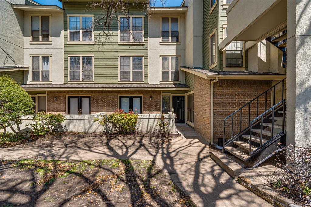 9611 Walnut Street, Unit 1106 Dallas, TX 75081 - Photo 2 of 31 a front view of a house with balcony