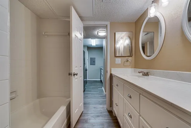 a bathroom with a bathtub and a shower