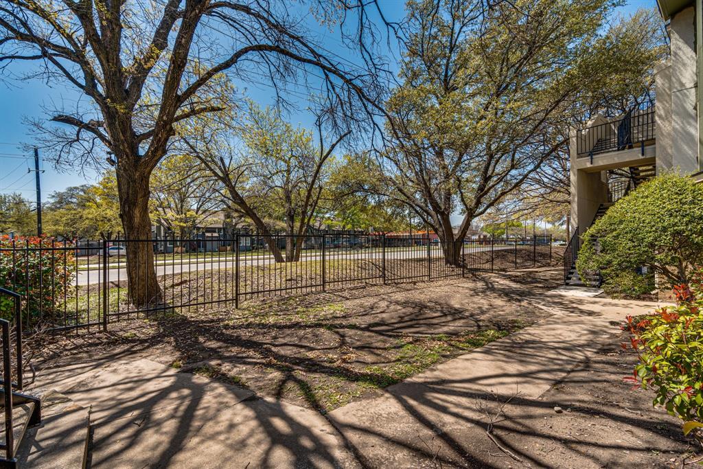 9611 Walnut Street, Unit 1106 Dallas, TX 75081 - Photo 30 of 31 a view of yard with trees