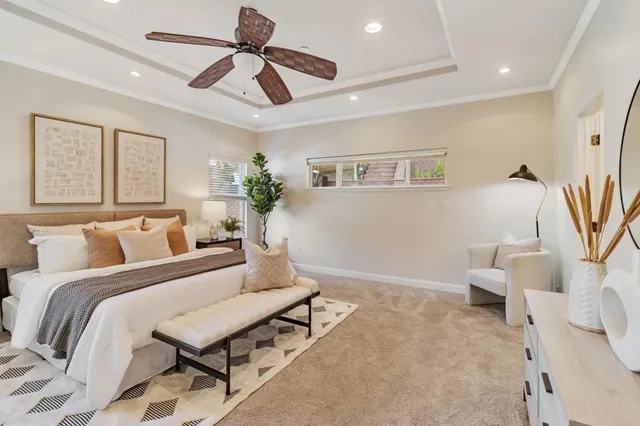 a bedroom with furniture and a chandelier