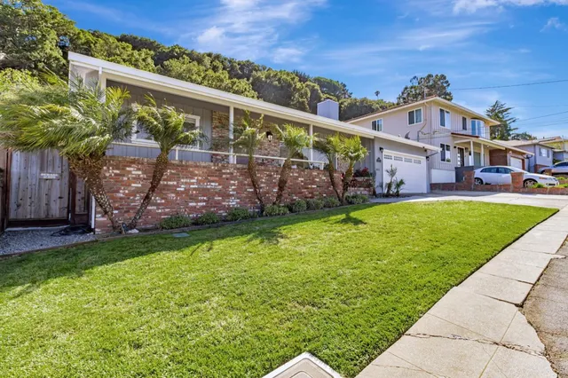 front view of a house with a yard