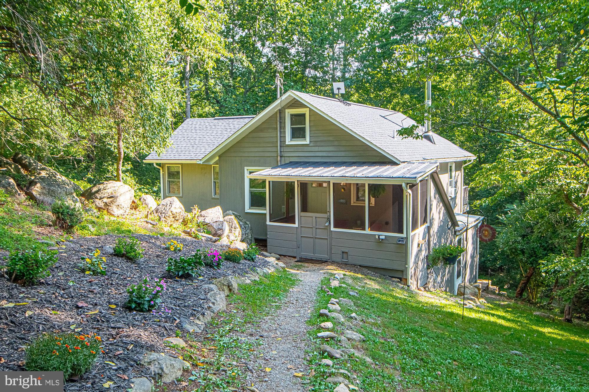 61 Mt Marshall Road Washington, VA 22747 - Photo 2 of 54 a front view of a house with garden