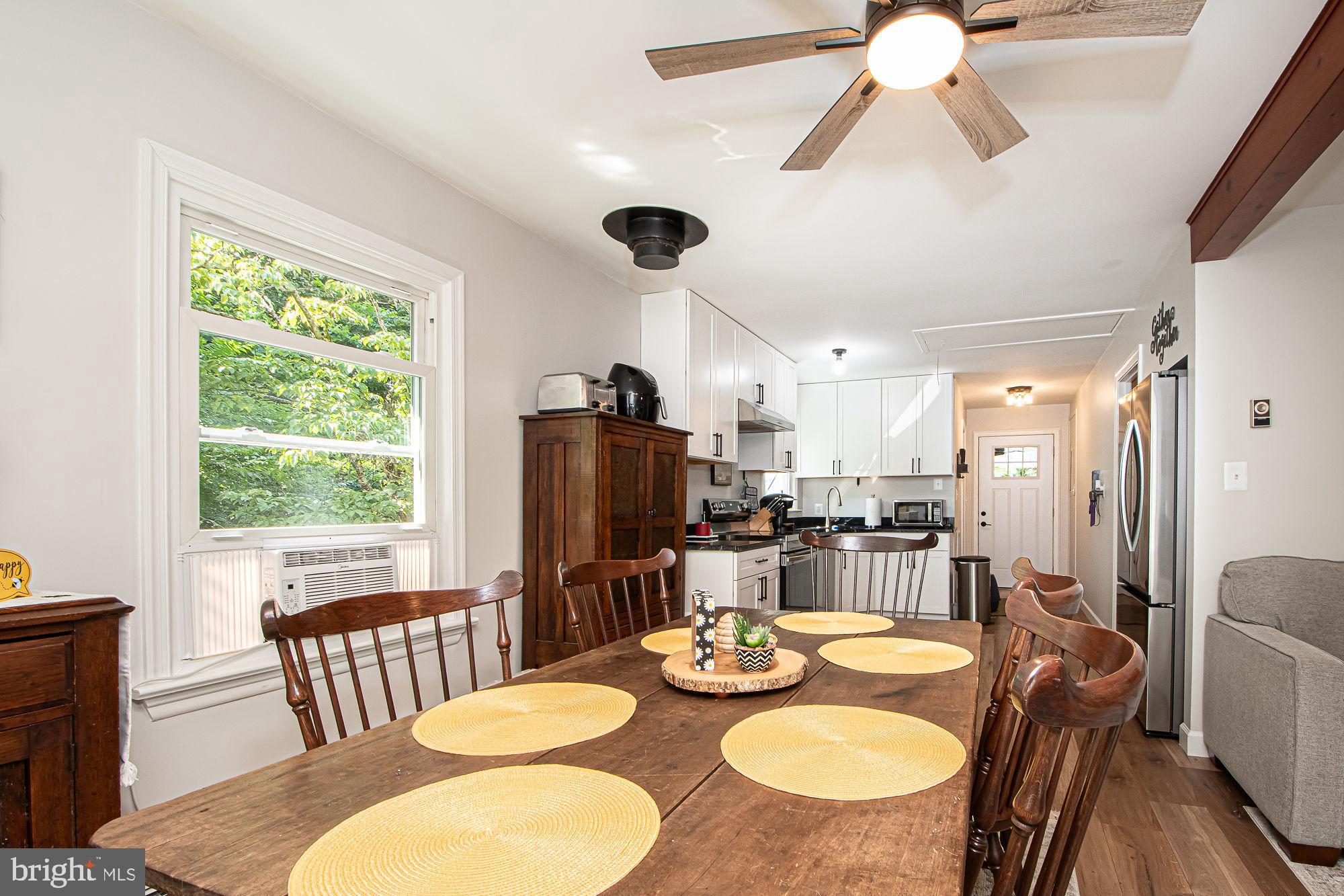 61 Mt Marshall Road Washington, VA 22747 - Photo 21 of 54 a dining room with furniture a window and wooden floor