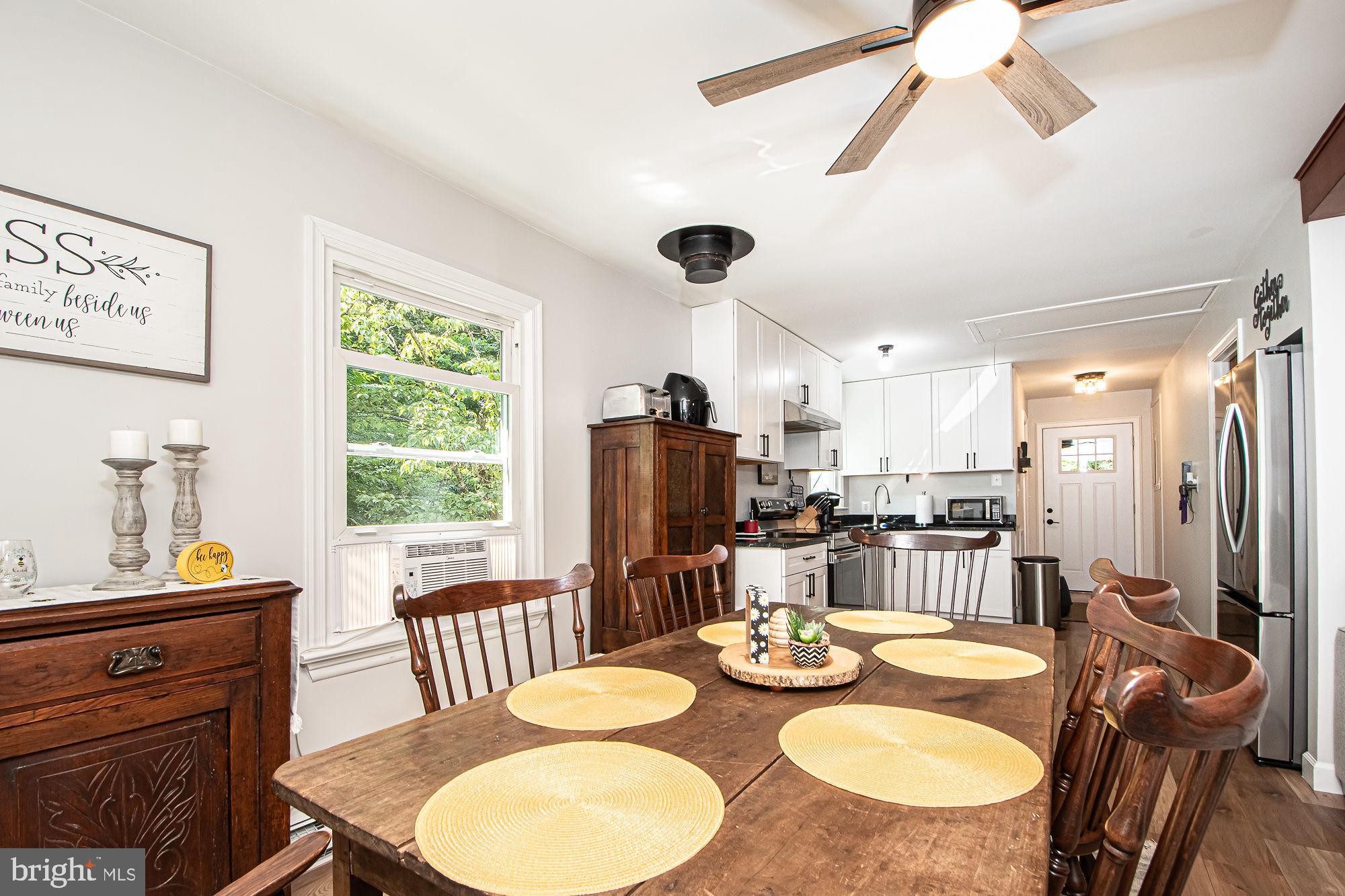 61 Mt Marshall Road Washington, VA 22747 - Photo 22 of 54 a dining room with furniture and a window