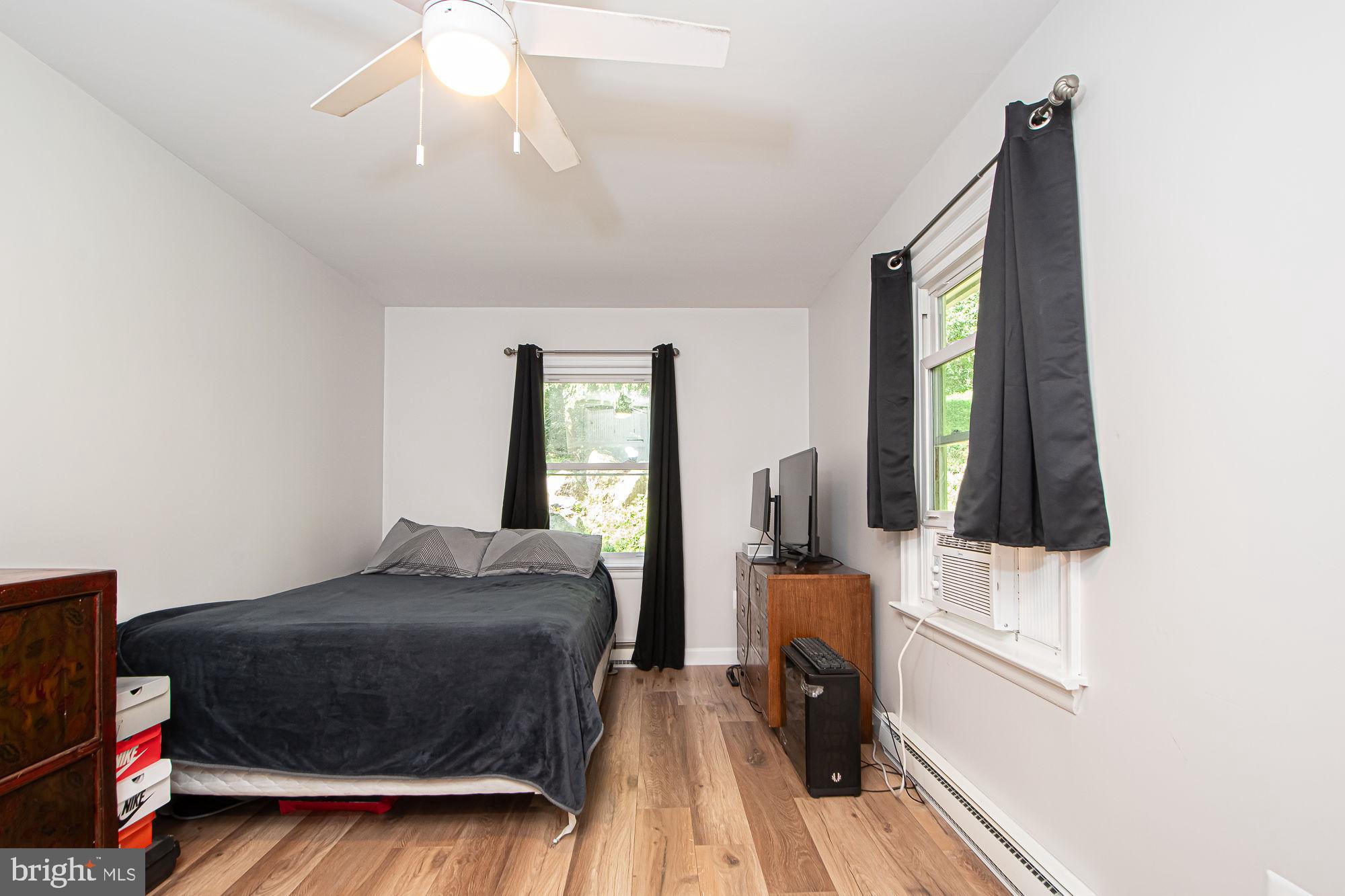 61 Mt Marshall Road Washington, VA 22747 - Photo 25 of 54 a bedroom with a bed and wooden floor