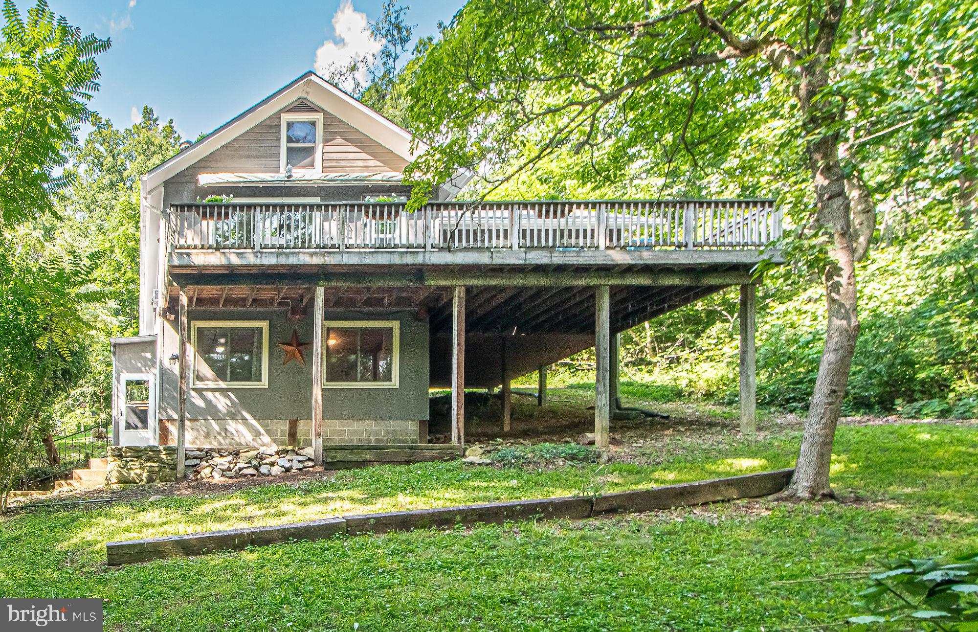61 Mt Marshall Road Washington, VA 22747 - Photo 3 of 54 a front view of a house with a yard