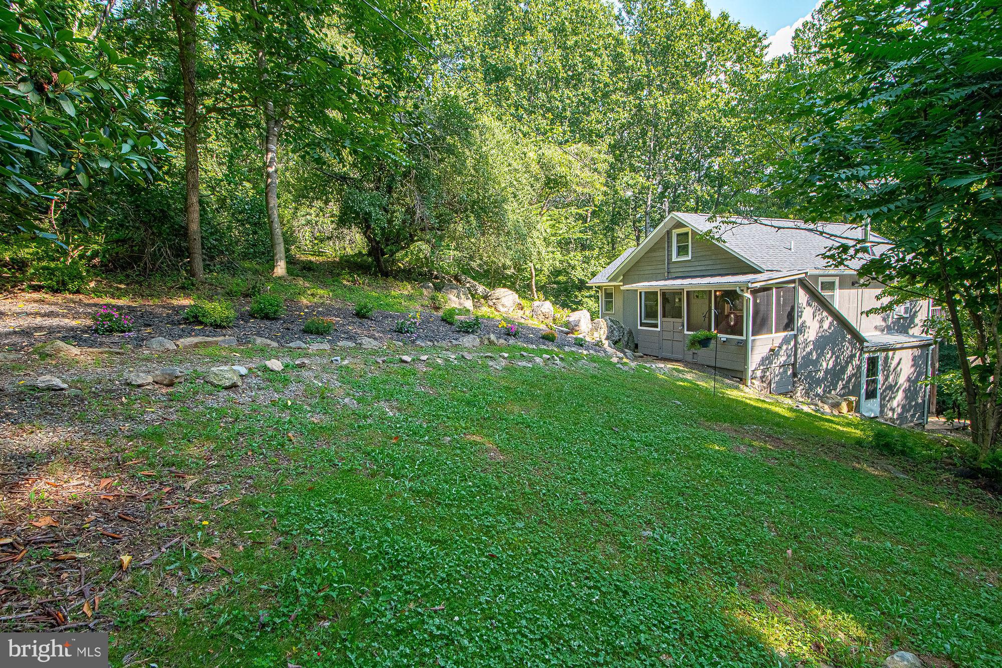 61 Mt Marshall Road Washington, VA 22747 - Photo 41 of 54 a front view of a house with garden