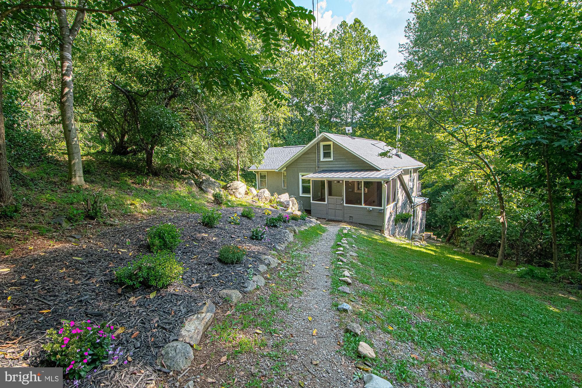 61 Mt Marshall Road Washington, VA 22747 - Photo 43 of 54 a front view of a house with garden