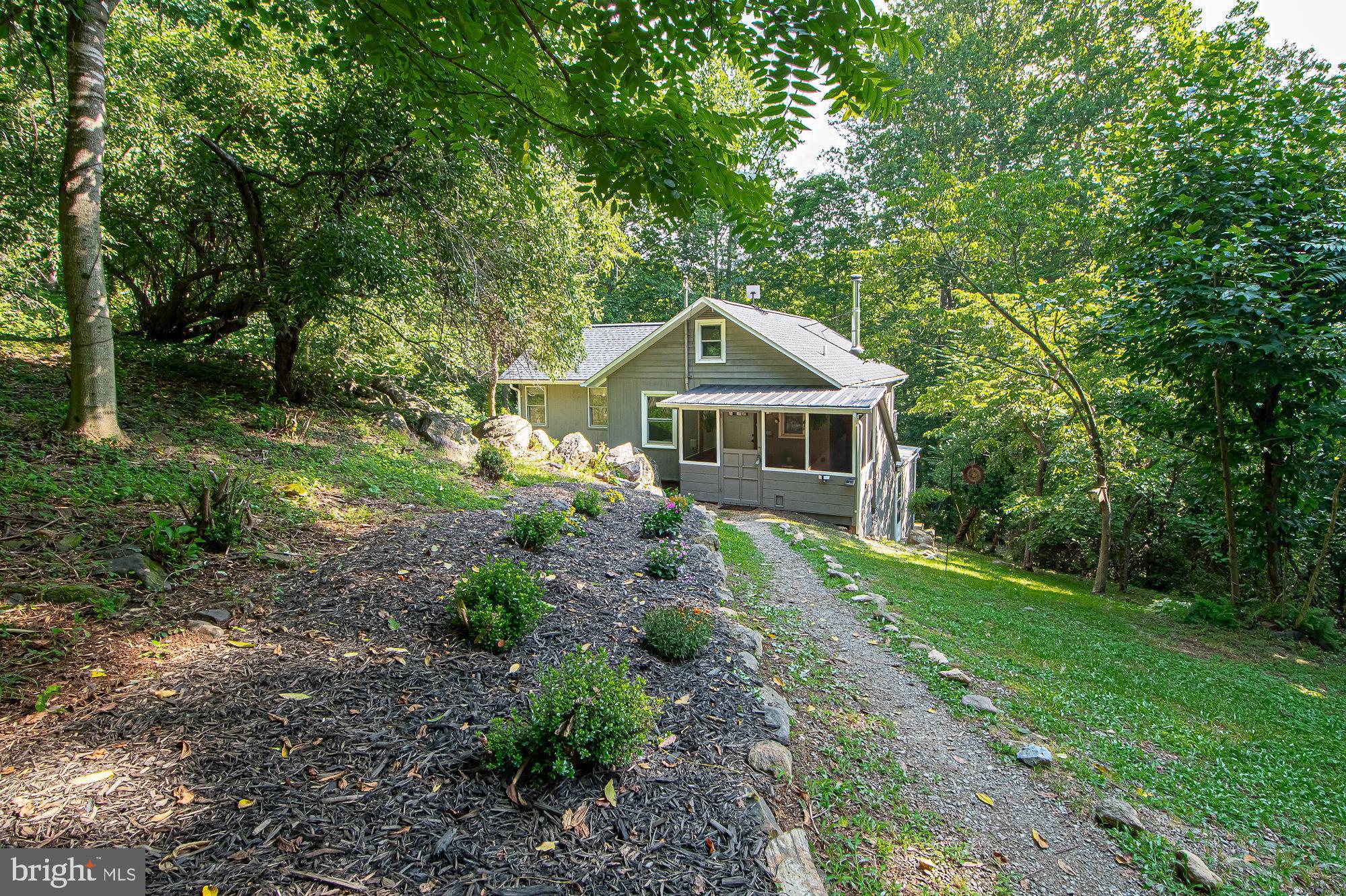 61 Mt Marshall Road Washington, VA 22747 - Photo 44 of 54 a front view of a house with garden