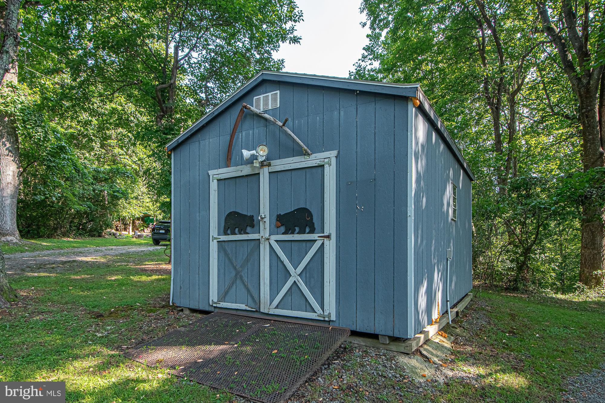 61 Mt Marshall Road Washington, VA 22747 - Photo 48 of 54 a house with garden in front of it