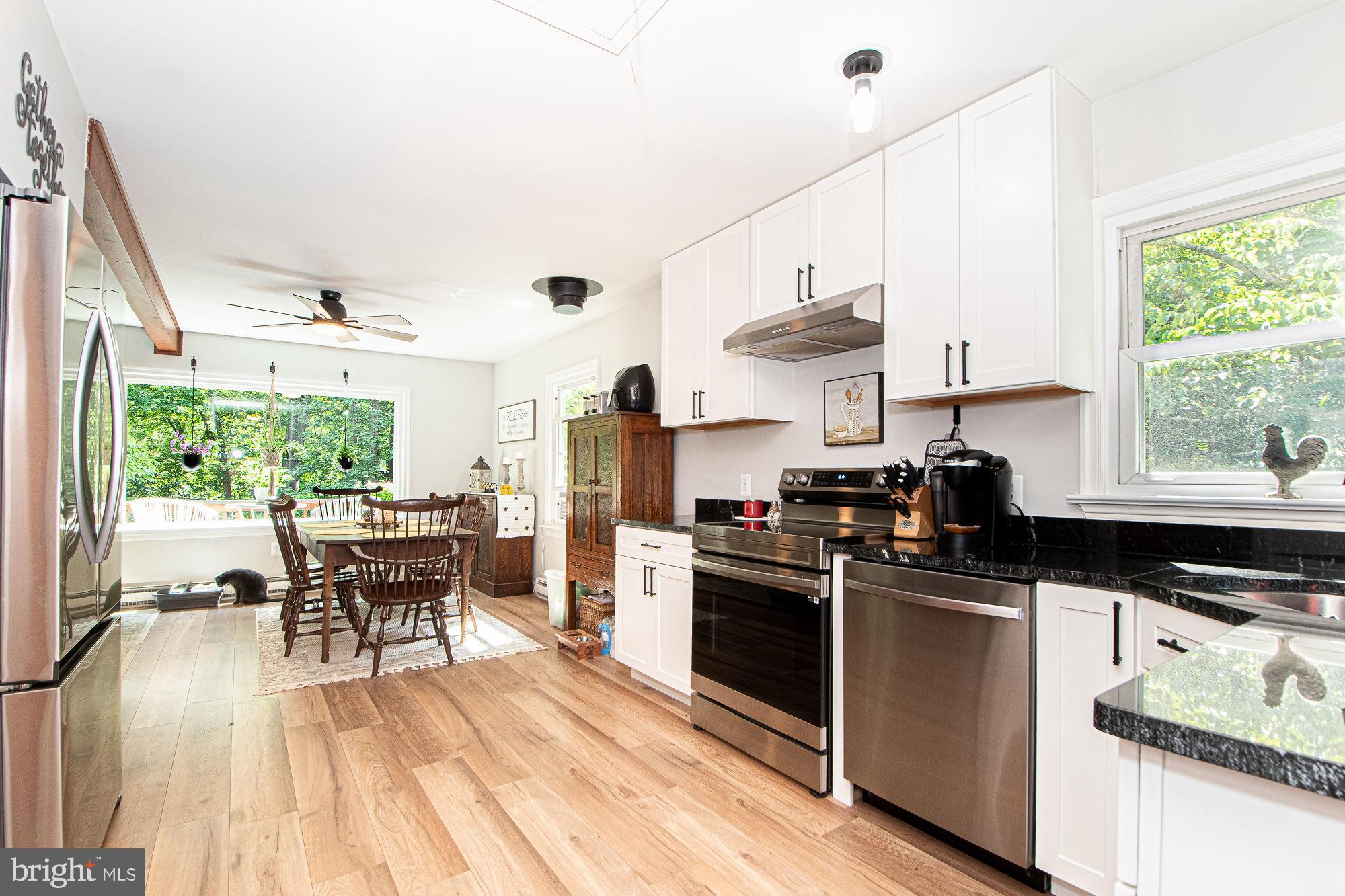 61 Mt Marshall Road Washington, VA 22747 - Photo 6 of 54 a kitchen with stainless steel appliances granite countertop a stove and a refrigerator