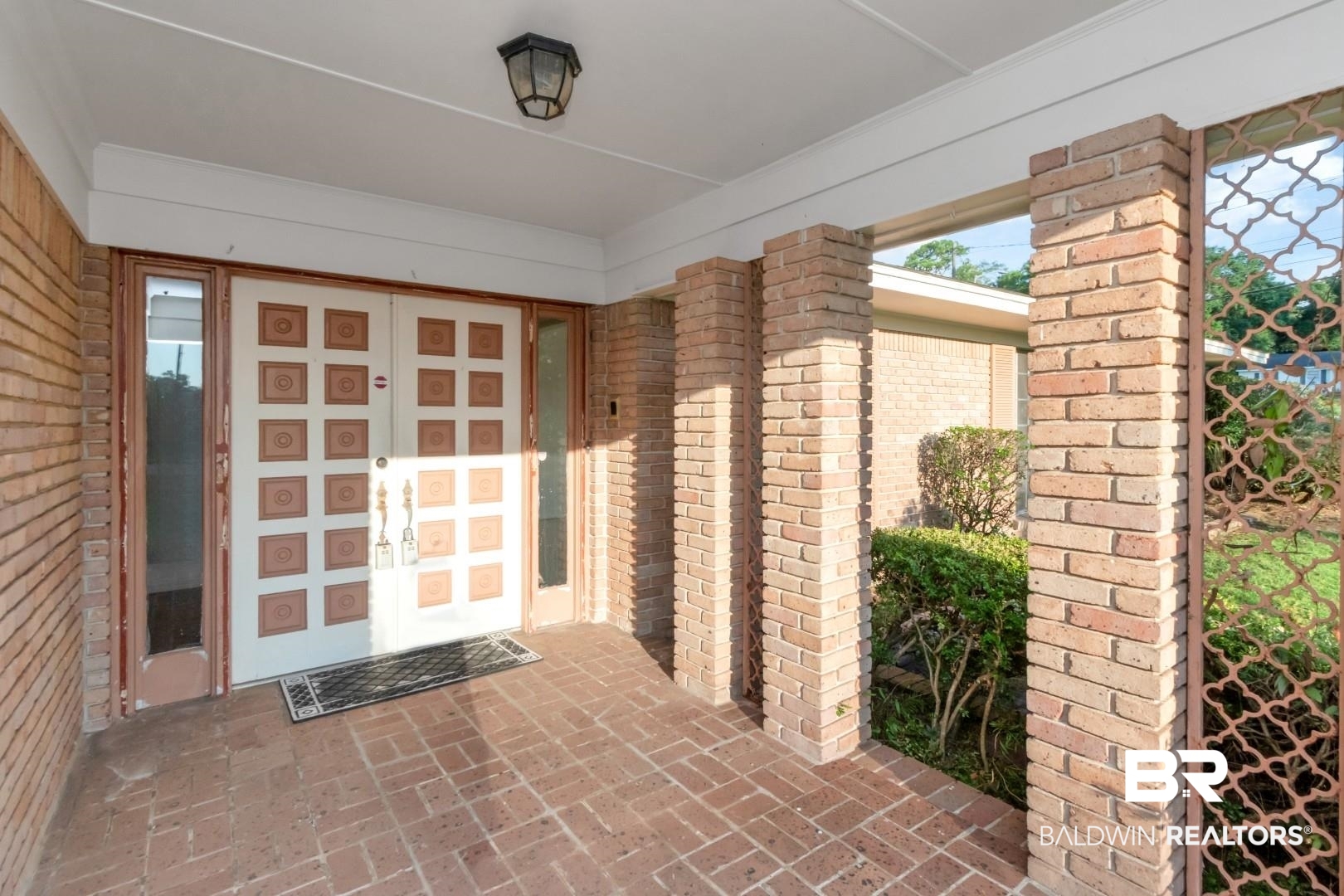 241 Suzanne Circle Mobile, AL 36608 - Photo 2 of 41 Doorway to property featuring brick siding
