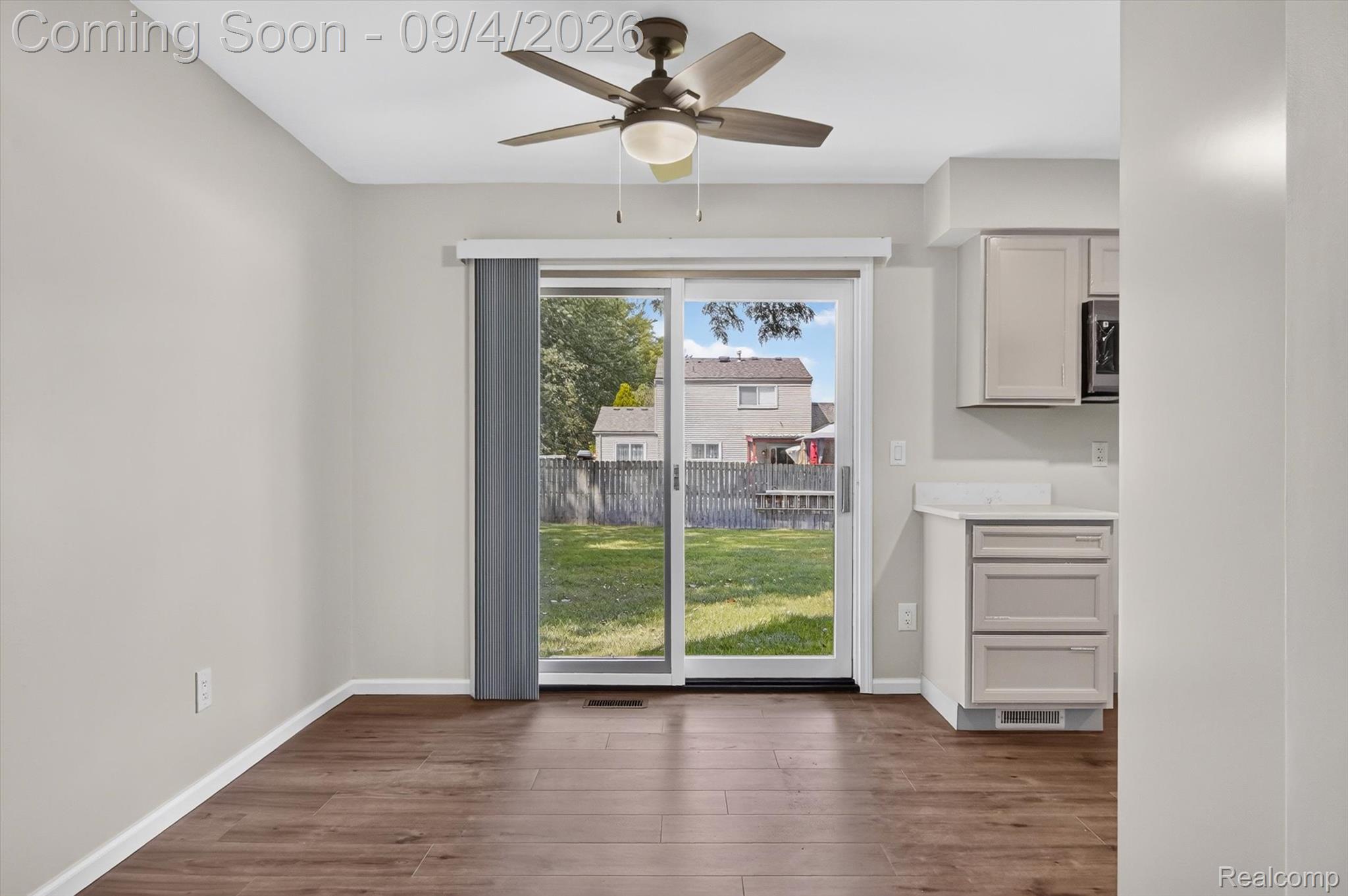 43182 Applewood Road Canton, MI 48188 - Photo 11 of 36 Wood-finish flooring throughout, sliding glass door, recessed lighting, and a ceiling fan with light fixture