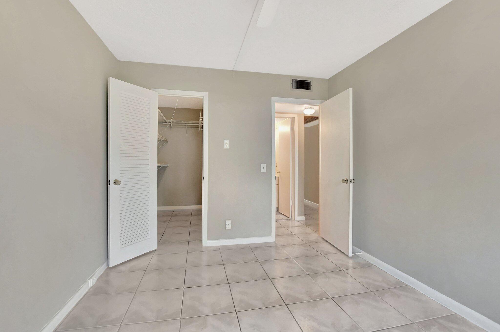 296 Fanshaw H Boca Raton, FL 33434 - Photo 21 of 74 Primary Bedroom WIC