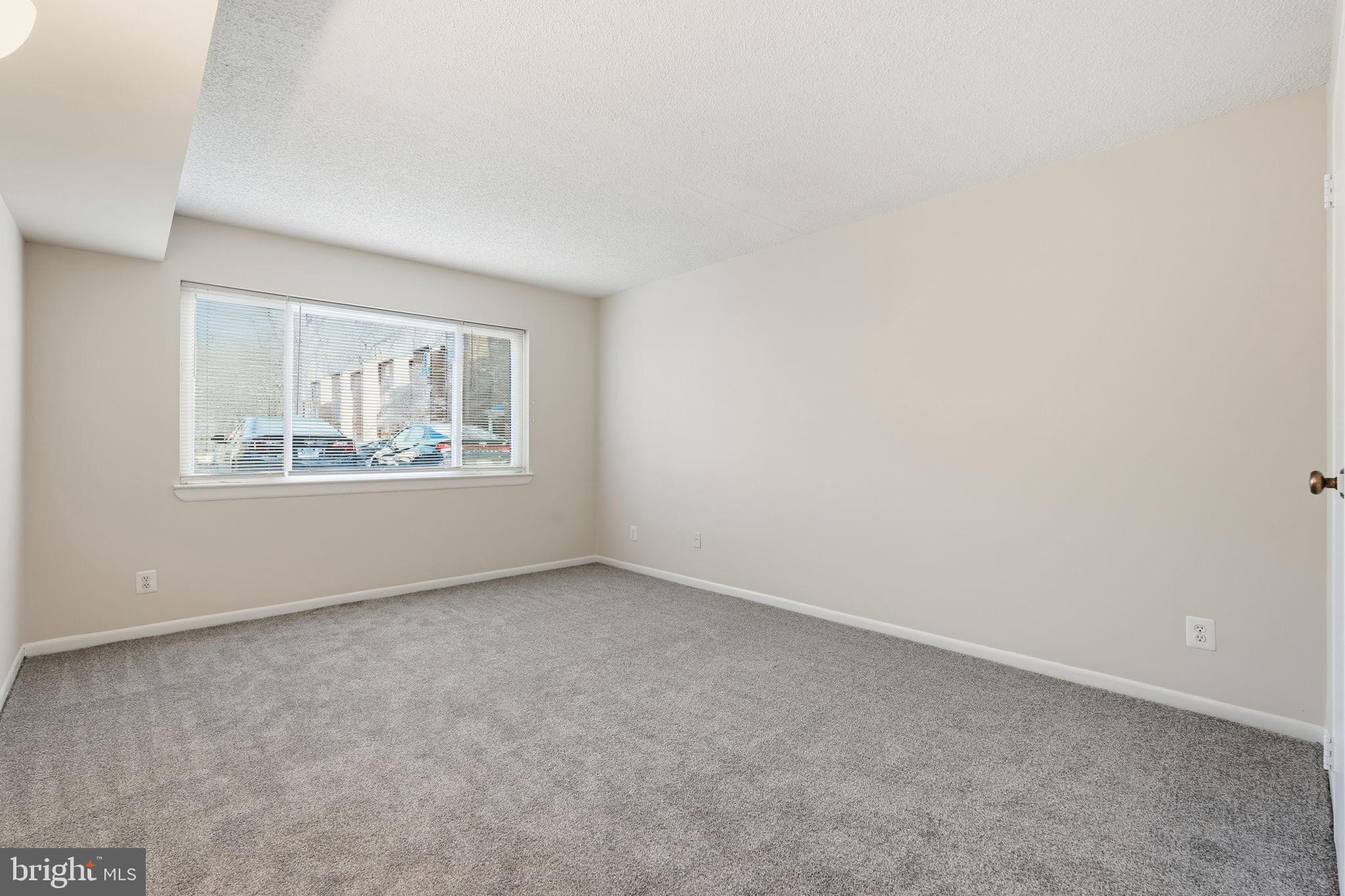 11807 Breton Court, Unit 2B Reston, VA 20191 - Photo 14 of 30 Sun soaked and spacious primary bedroom.