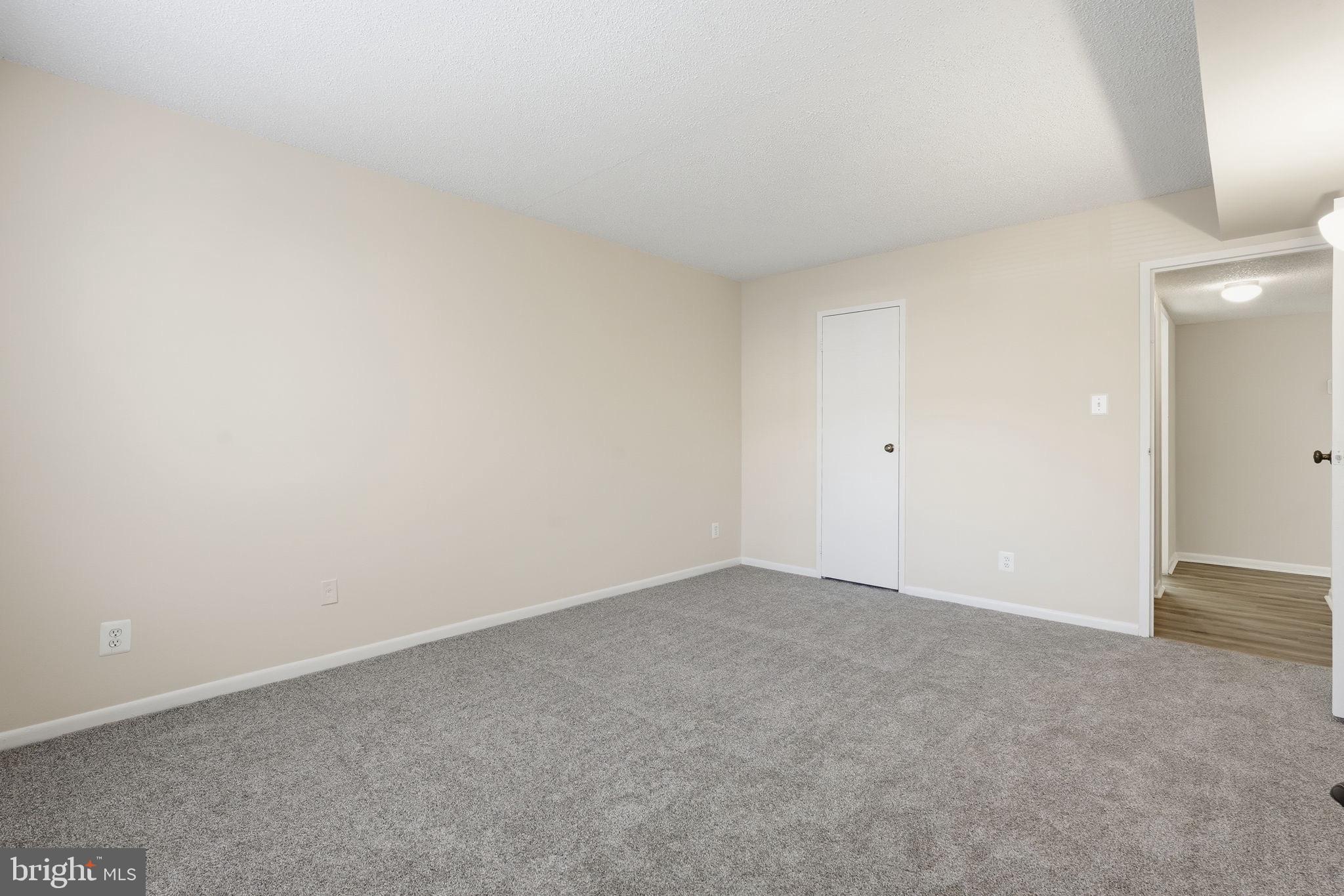 11807 Breton Court, Unit 2B Reston, VA 20191 - Photo 16 of 30 Primary bedroom with brand new carpet.