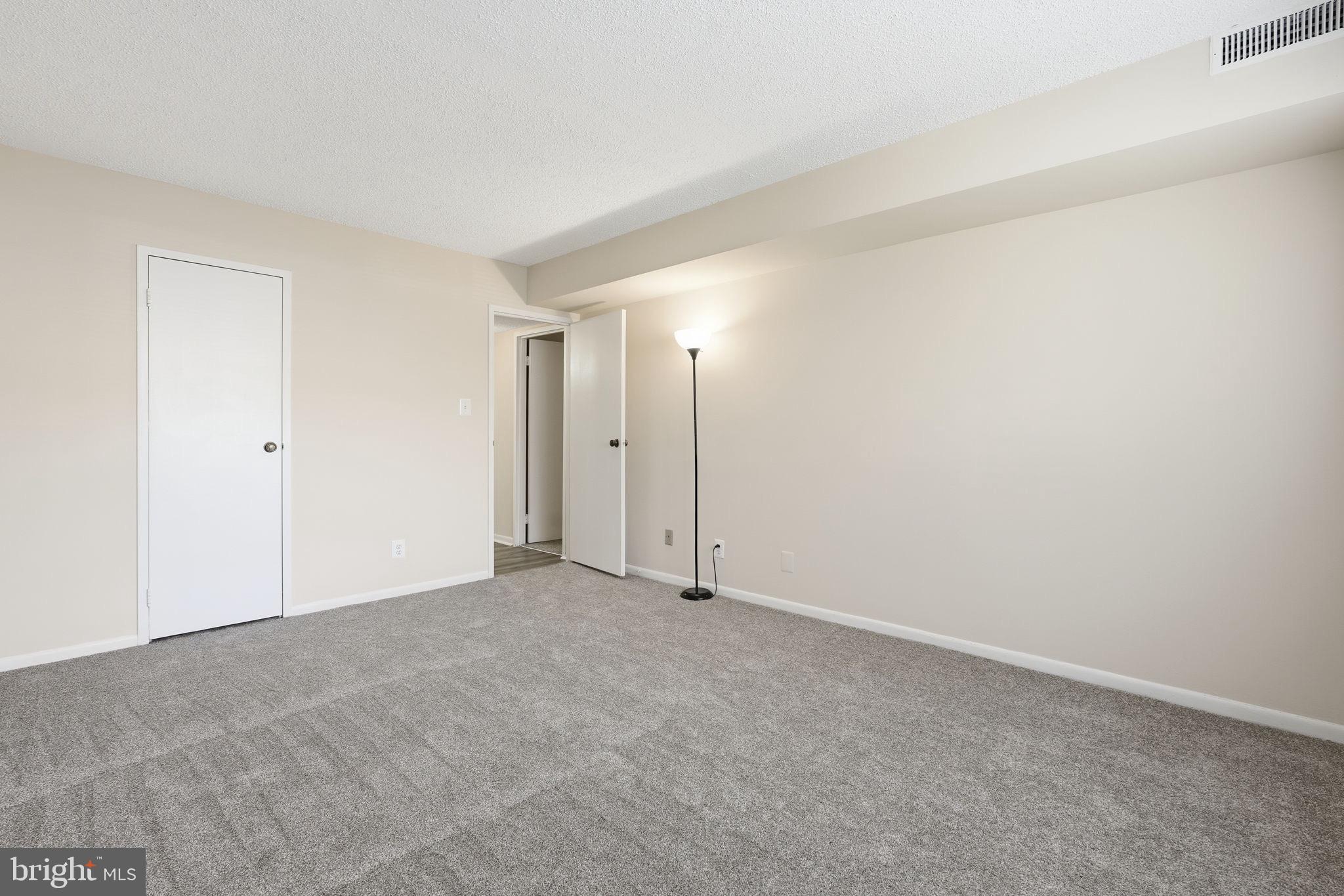 11807 Breton Court, Unit 2B Reston, VA 20191 - Photo 17 of 30 Primary bedroom.