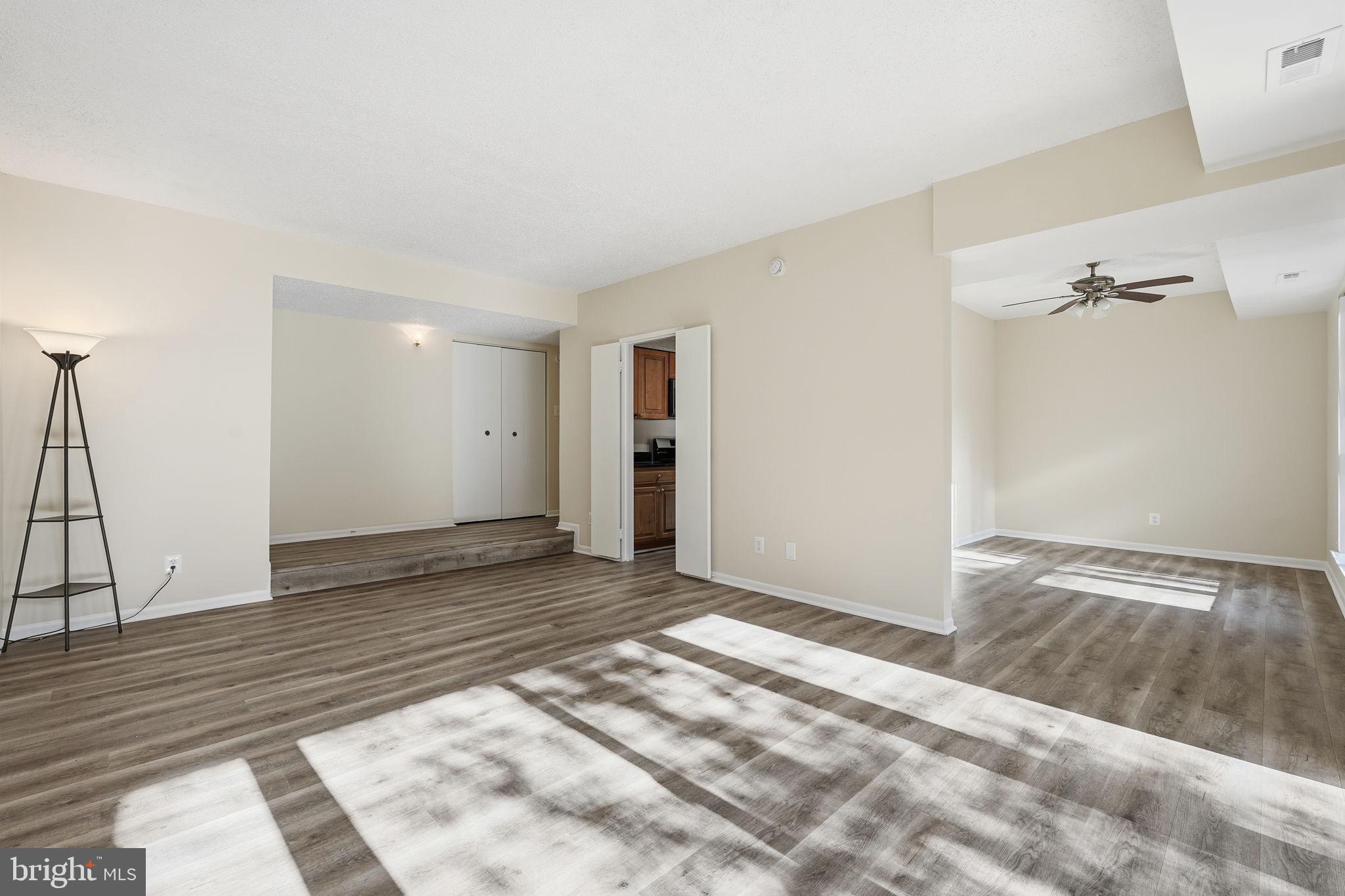 11807 Breton Court, Unit 2B Reston, VA 20191 - Photo 6 of 30 Spacious, sunlit living area with modern charm.