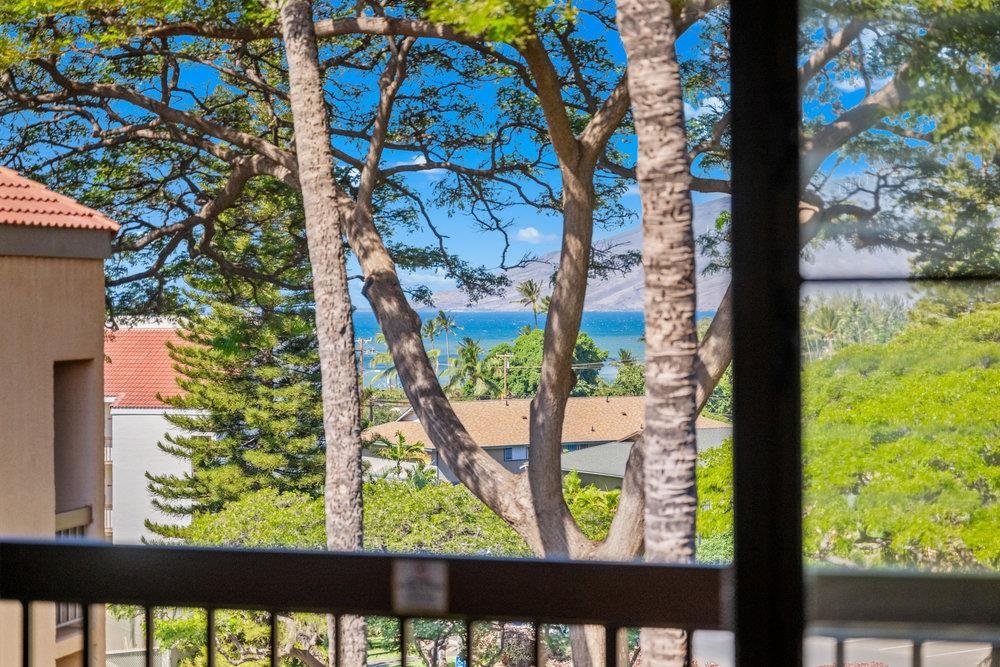 a view of a yard from a balcony