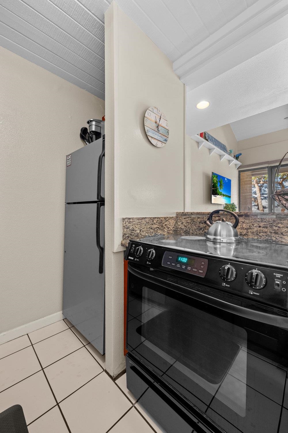 2191 South Kihei Road, Unit 2413 Kihei, HI 96753 - Photo 15 of 32 a stove top oven sitting inside of a kitchen