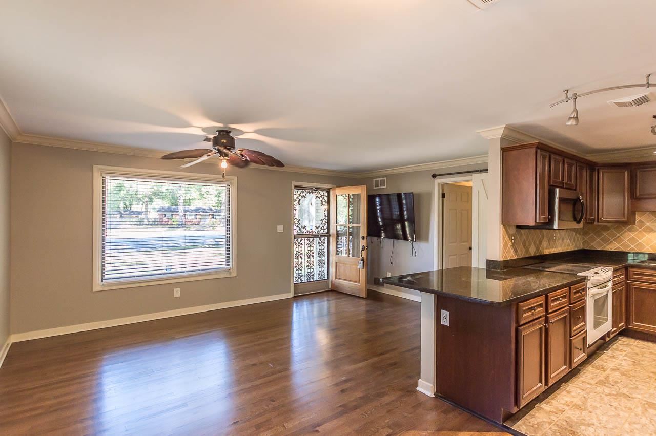5093 Dee Road Memphis, TN 38117 - Photo 7 of 21 a kitchen with stainless steel appliances granite countertop a stove top oven and a sink with granite countertops