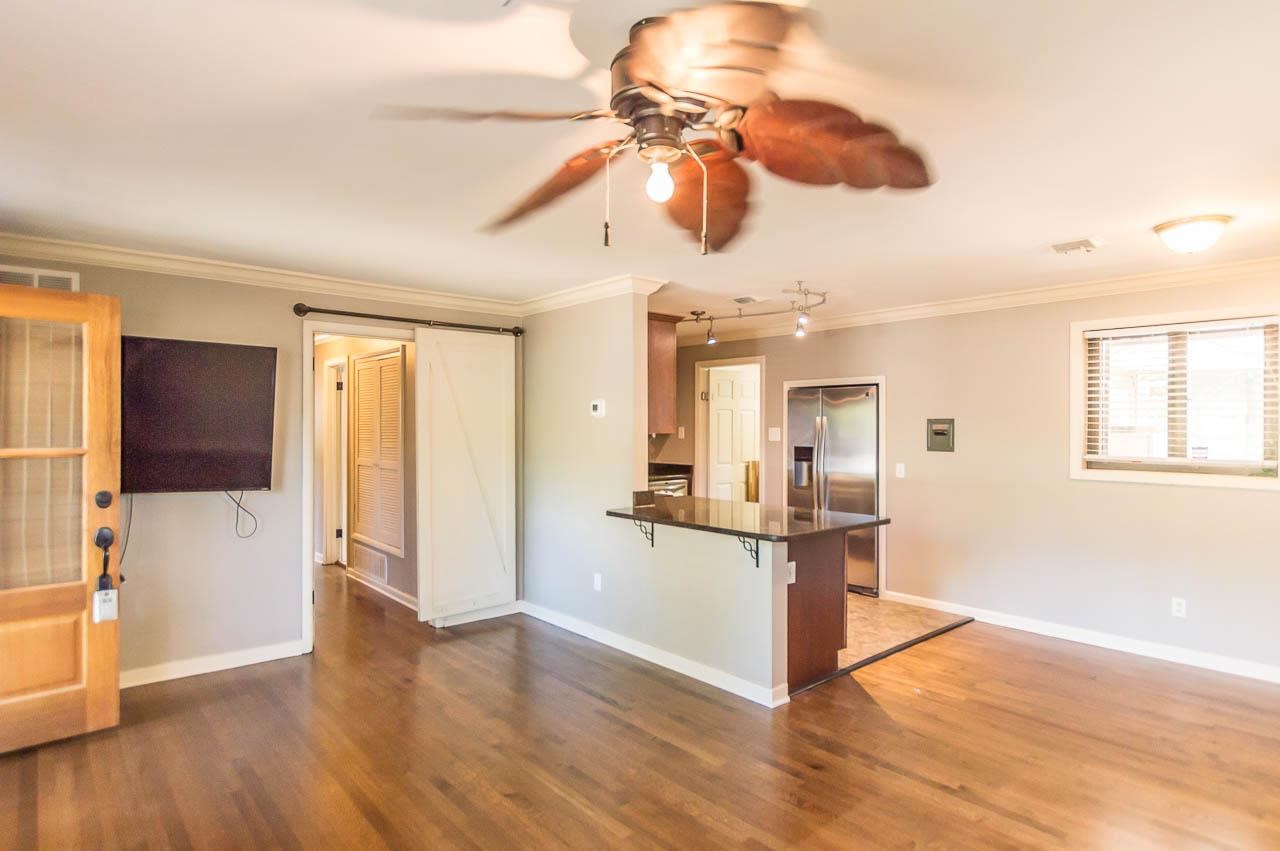 5093 Dee Road Memphis, TN 38117 - Photo 8 of 21 a view of a living room and a chandelier fan