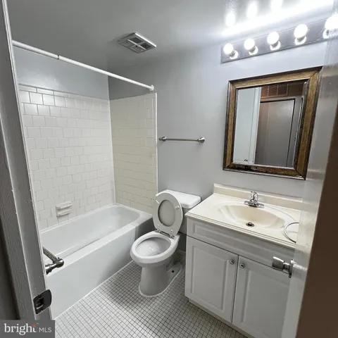 a bathroom with a toilet a sink and a bathtub