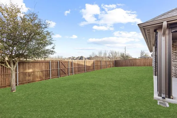 a view of a backyard with a garden