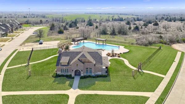 a view of a swimming pool with a yard