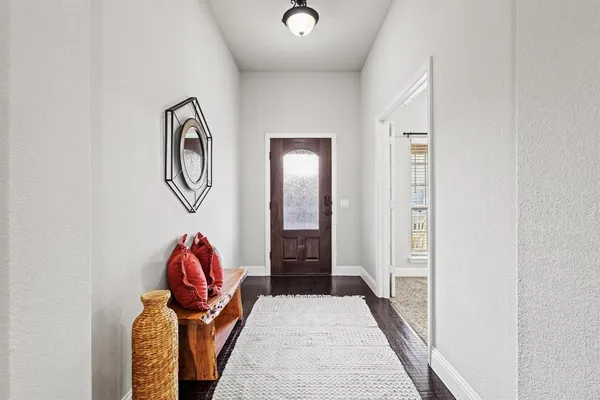 a view of entryway with wooden floor