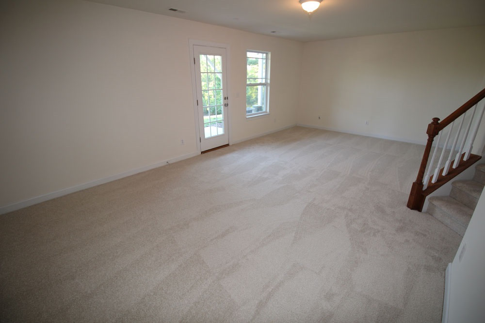 251 Broadgait Brae Road Cary, NC 27519 - Photo 20 of 25 Spacious walk-out bonus/rec room in lower level with NEW carpet. Bonus/Rec Room