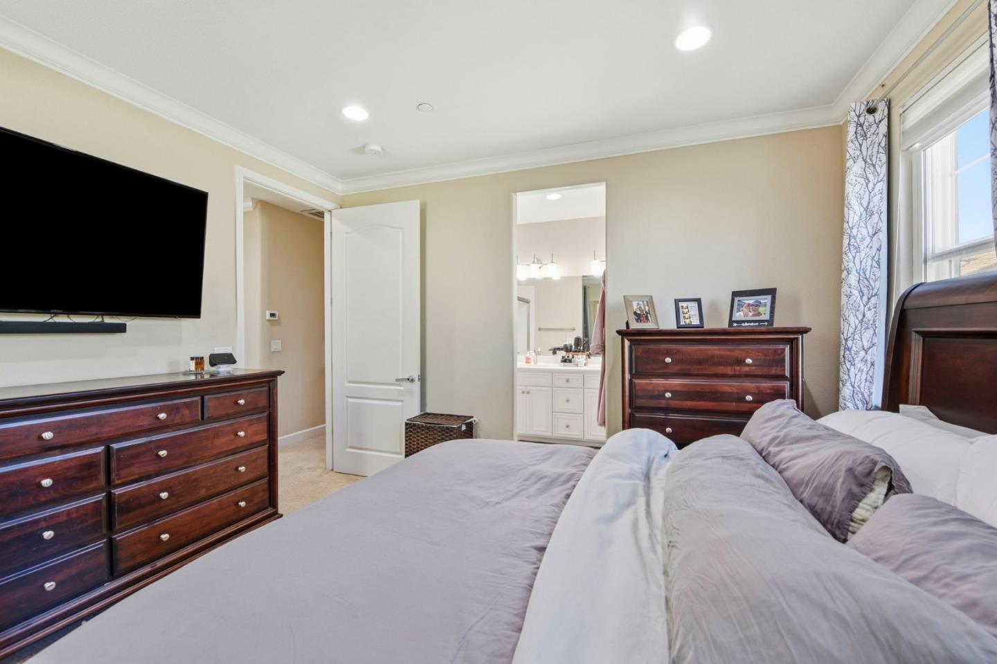 56 Regency Place Hayward, CA 94544 - Photo 21 of 43 a bedroom with a bed and a flat screen tv