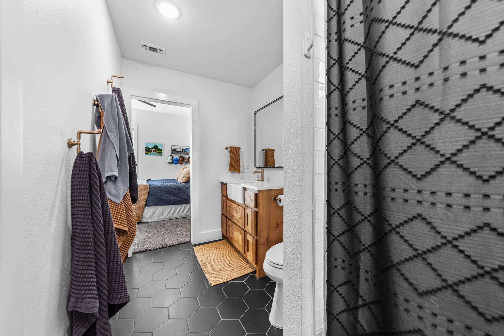 1800 Diamond Ridge Drive Lampasas, TX 76550 - Photo 18 of 40 Ensuite bathroom featuring vanity, a shower stall, and dark tile patterned flooring