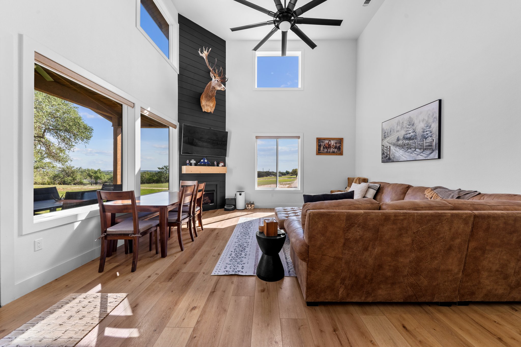 1800 Diamond Ridge Drive Lampasas, TX 76550 - Photo 2 of 40 Living room with a high ceiling, light wood finished floors, a ceiling fan, and a fireplace