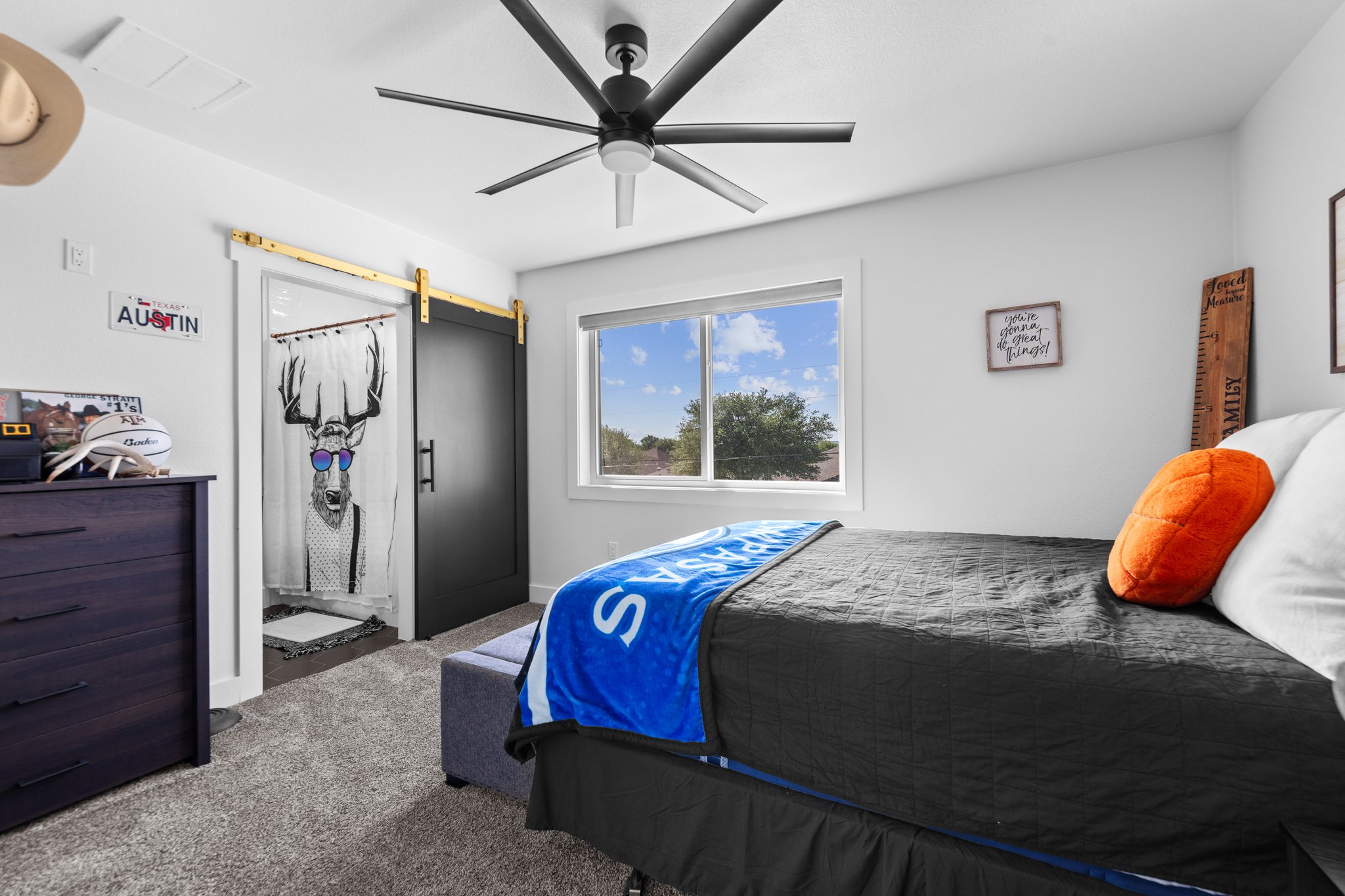 1800 Diamond Ridge Drive Lampasas, TX 76550 - Photo 24 of 40 Carpeted bedroom featuring a barn door, a ceiling fan, and ensuite bath