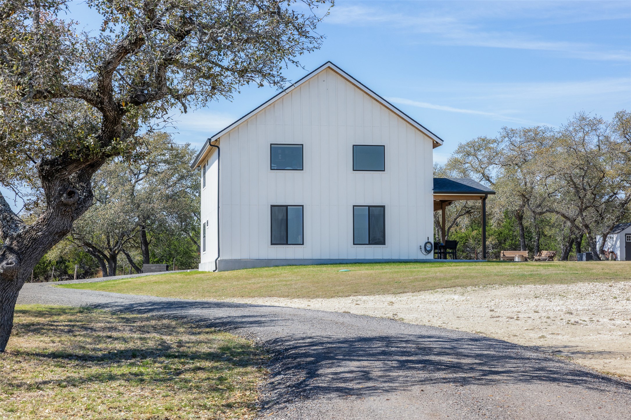 1800 Diamond Ridge Drive Lampasas, TX 76550 - Photo 34 of 40 View of side of property with board and batten siding and a yard