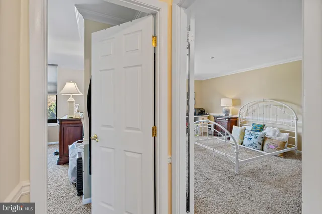 a view of a hallway with room and furniture