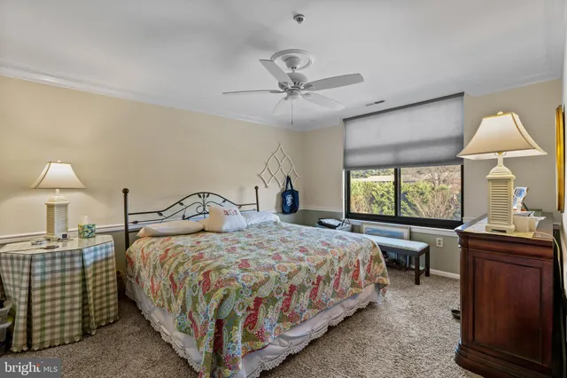 a bedroom with a bed and a table