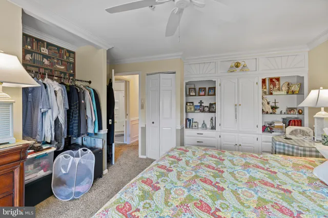 a bedroom with a bed and walk in closet