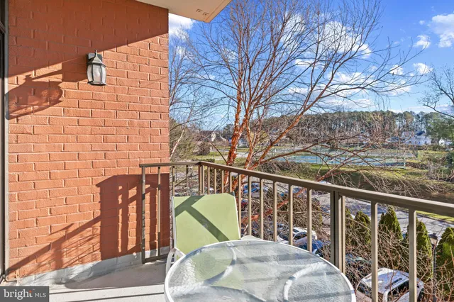a view of a balcony with chairs