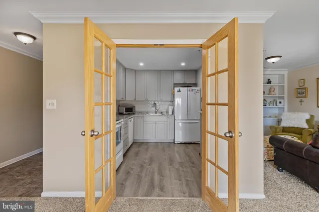 a bathroom with a refrigerator a sink and a dishwasher